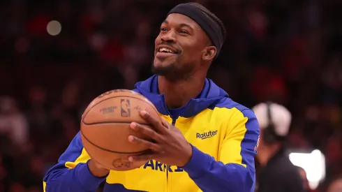 immy Butler #10 warms up prior to his debut with the Golden State Warriors against the Chicago Bulls