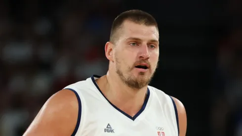 Nikola Jokic #15 of Team Serbia brings the ball up the court during the Men's Quarterfinal match between Australia and Serbia on day eleven of the Olympic Games