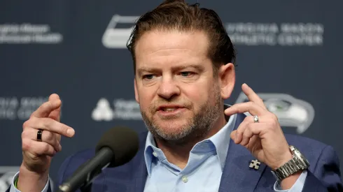John Schneider, general manager of the Seattle Seahawks, reacts as he announces Mike Macdonald as the new Seattle Seahawks head coach at Virginia Mason Athletic Center on February 01, 2024 in Renton, Washington.