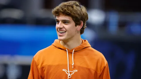 Arch Manning #16 of the Texas Longhorns warms up prior to the Chick-fil-A Peach Bowl between the Texas Longhorns and Arizona State Sun Devils at Mercedes-Benz Stadium on January 1, 2025 in Atlanta, Georgia.