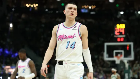 Tyler Herro #14 of the Miami Heat walks backcourt during a game against the Milwaukee Bucks at Fiserv Forum.
