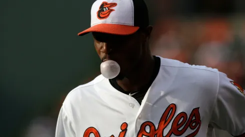 Centerfielder Adam Jones #10 of the Baltimore Orioles blows a bubble with his gum as he warms up before the start of a game against the Cleveland Indians in 2013.