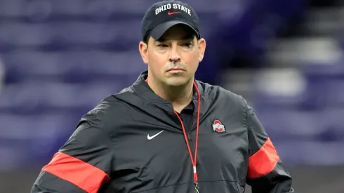 Ryan Day the head coach of the Ohio State Buckeyes watches his team practice before the start of the BIG Ten Football Championship game against the Wisconsin Badgers at Lucas Oil Stadium on December 07, 2019 in Indianapolis, Indiana.
