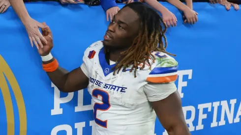 Ashton Jeanty #2 of the Boise State Broncos high fives fans following the Vrbo Fiesta Bowl against the Penn State Nittany Lions at State Farm Stadium on December 31, 2024 in Glendale, Arizona. The Nittany Lions defeated the Broncos 31-14.