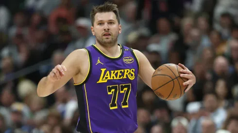 Luka Doncic #77 of the Los Angeles Lakers plays the Denver Nuggets in the first quarter at Ball Arena.