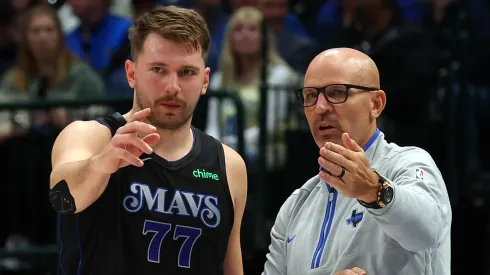 Luka Doncic #77 of the Dallas Mavericks talks with head coach Jason Kidd in the first half of the NBA In-Season Tournament game against the LA Clippers at American Airlines Center.