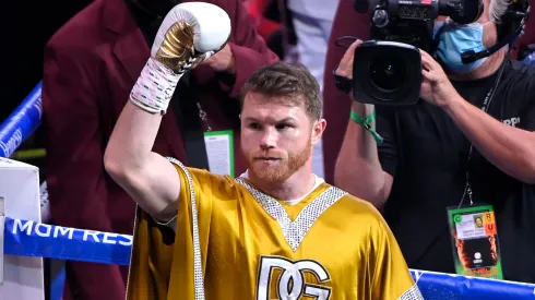 Canelo Alvarez acknowledges the crowd while celebrating after his 11th round technical knock out win of Caleb Plant after their championship bout for Alvarez's WBC, WBO and WBA super middleweight titles and Plant's IBF super middleweight title at MGM Grand Garden Arena.