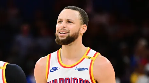Stephen Curry #30 and Gary Payton II #0 of the Golden State Warriors react in the second half against the Orlando Magic