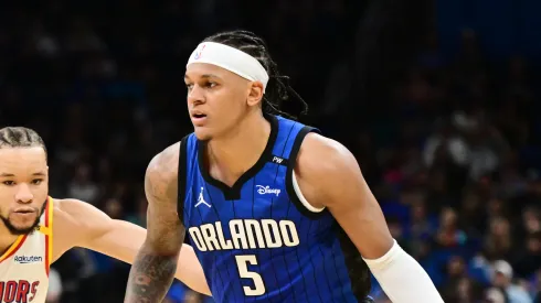 Paolo Banchero #5 of the Orlando Magic drives to the basket against Kevin Knox II #31 of the Golden State Warriors