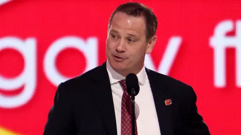 General manager Craig Conroy of the Calgary Flames announces the ninth overall pick during the first round of the 2024 Upper Deck NHL Draft at Sphere on June 28, 2024 in Las Vegas, Nevada.