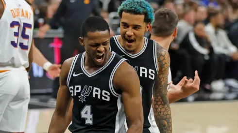 De'Aaron Fox #4 of the San Antonio Spurs celebrates after his basket with teammate Jeremy Sochan #10 in the second half against the Phoenix Suns at Moody Center on February 20, 2025 in Austin, Texas.