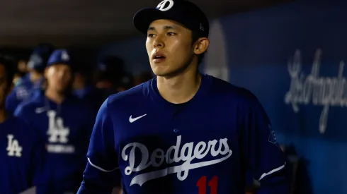 Roki Sasaki #11 of the Los Angeles Dodgers walks through the dugout to take the field in the fifth inning during a spring training game against the Cincinnati Reds at Camelback Ranch on March 4, 2025 in Glendale, Arizona.