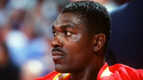 Hakeem Olajuwon on the bench before a 1993 NBA game between the Houston Rockets and the Denver Nuggets.