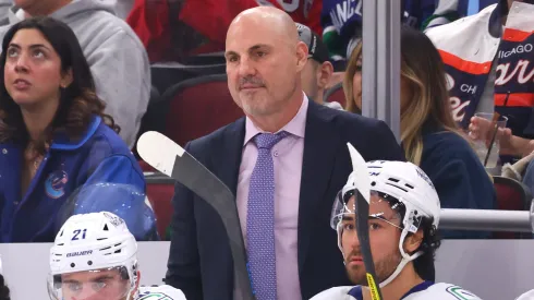 Head coach Rick Tocchet of the Vancouver Canucks looks on against the Chicago Blackhawks during the first period at the United Center on October 22, 2024 in Chicago, Illinois.
