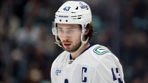 Quinn Hughes #43 of the Vancouver Canucks looks on during the first period against the Seattle Kraken at Climate Pledge Arena on March 01, 2025 in Seattle, Washington.