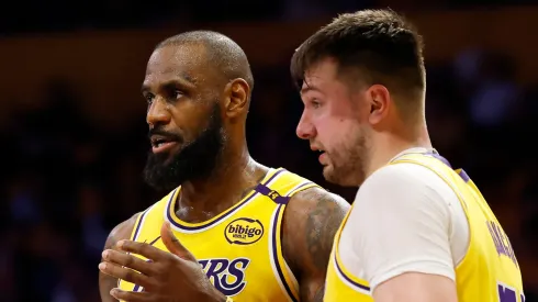 LeBron James #23 and Luka Doncic #77 of the Los Angeles Lakers talk during the third quarter of a game against the Utah Jazz.