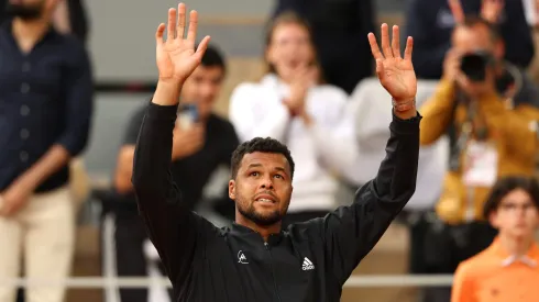 Jo-Wilfried Tsonga of France waves goodbye to the crowd after losing his match against Casper Ruud of Norway, his last match at Roland Garros during the Men's Singles First Round match on Day 3 of the French Open at Roland Garros on May 24, 2022 in Paris, France.