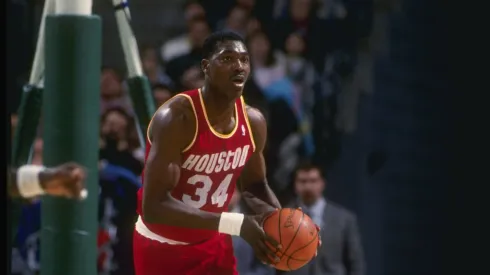 Center Hakeem Olajuwon of the Houston Rockets in action with the ball.