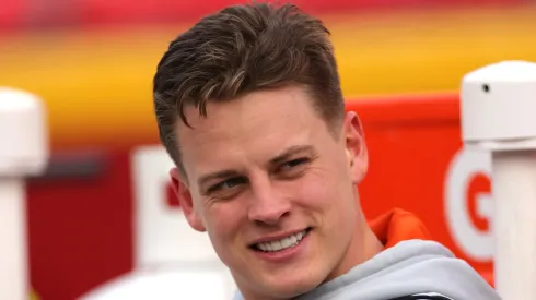 Joe Burrow #9 of the Cincinnati Bengals looks on from the bench before the start of the AFC Championship Game against the Kansas City Chiefs on January 30, 2022 in Kansas City, Missouri.
