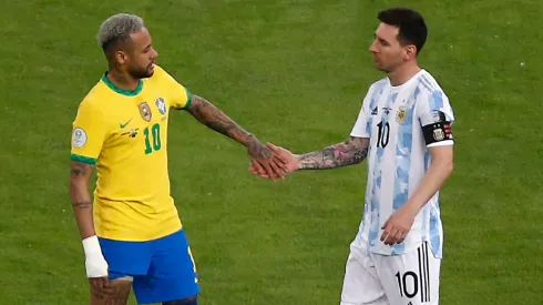 Neymar Jr. of Brazil greets Lionel Messi of Argentina as Lautaro Martinez of Argentina prepares for kick off prior to the final of Copa America Brazil 2021 between Brazil and Argentina at Maracana Stadium on July 10, 2021 in Rio de Janeiro, Brazil.