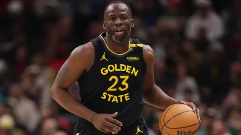 Draymond Green #23 of the Golden State Warriors dribbles up the court against the Chicago Bulls during the first half at the United Center.
