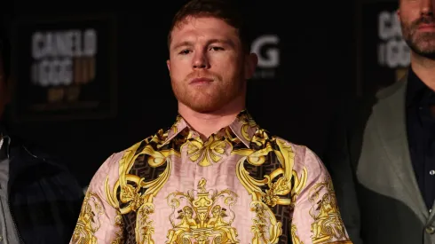 Boxer Canelo Alvarez poses with his championship belts at the end of the press conference during the press tour for his fight against Gennady Golovkin on June 27, 2022 in New York City.
