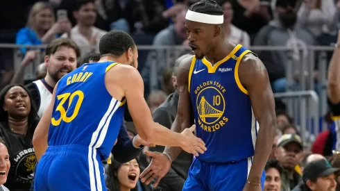 Jimmy Butler III #10 and Stephen Curry #30 of the Golden State Warriors celebrate after Butler scored and was fouled on the shot against the Dallas Mavericks during the first half at Chase Center on February 23, 2025 in San Francisco, California.