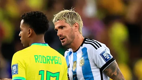 Rodrigo de Paul talks to Rodrygo of Brazil during a FIFA World Cup 2026 Qualifier match between Brazil and Argentina on November 21, 2023.