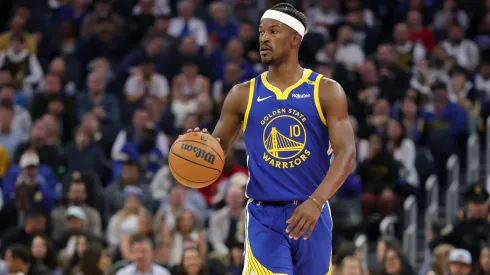 Jimmy Butler III #10 of the Golden State Warriors dribbles the ball against the Portland Trail Blazers at Chase Center.