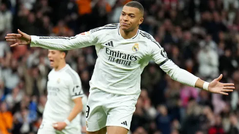Kylian Mbappe of Real Madrid celebrates scoring his team's first goal from the penalty spot during the LaLiga match between Real Madrid CF and CD Leganes at Estadio Santiago Bernabeu on March 29, 2025 in Madrid, Spain.