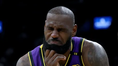 LeBron James #23 of the Los Angeles Lakers reacts after getting hit in the chin by Jayson Tatum #0 of the Boston Celtics