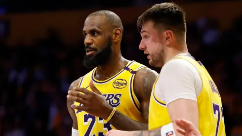 LeBron James and Luka Doncic of the Los Angeles Lakers talk during a game against the Utah Jazz on February 10, 2025.