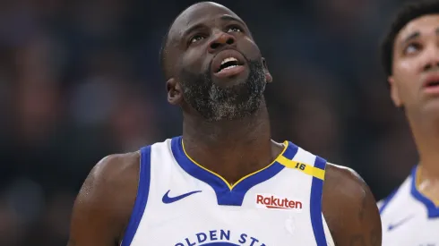 Draymond Green #23 and Trayce Jackson-Davis #32 of the Golden State Warriors look up at a replay during a 102-99 loss to the LA Clippers at Intuit Dome on November 18, 2024 in Inglewood, California.
