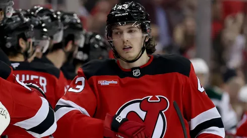 Luke Hughes #43 of the New Jersey Devils celebrates his goal with teammates on the b ench during the first period against the Minnesota Wild at Prudential Center on March 31, 2025 in Newark, New Jersey.