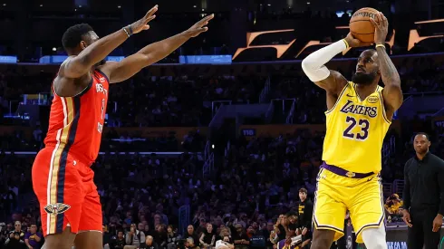 LeBron James #23 of the Los Angeles Lakers shoots a 3-point basket to score his 50,002 NBA regular season and playoff career points during the first half in 2025.