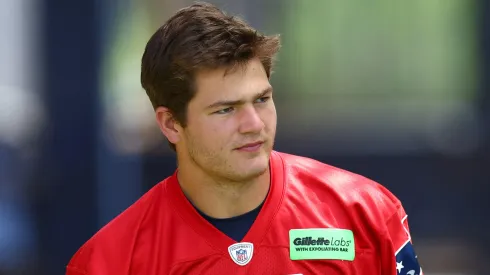 Drake Maye #10 of the New England Patriots walks to the field during the New England Patriots OTA Offseason Workout on May 29, 2024.