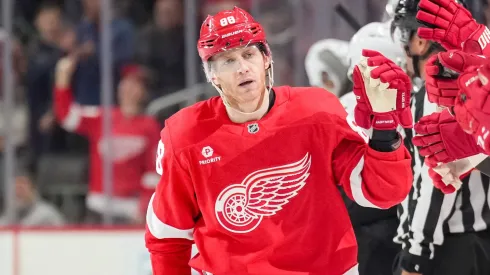 Patrick Kane #88 of the Detroit Red Wings high fives teammates after scoring a goal against the Ottawa Senators during the third period at Little Caesars Arena on March 27, 2025 in Detroit, Michigan.