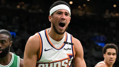 Devin Booker #1 of the Phoenix Suns reacts after a non-call during the third quarter against the Boston Celtics at the TD Garden on April 04, 2025 in Boston, Massachusetts.