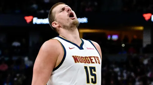 Nikola Jokic #15 of the Denver Nuggets reacts after making a shot in the first half against the Minnesota Timberwolves at Ball Arena on April 1, 2025 in Denver, Colorado.