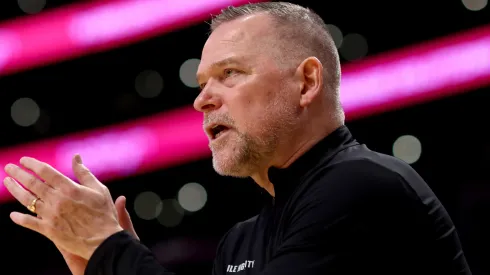Head coach Michael Malone of the Denver Nuggets cheers after a play during the second quarter against the Los Angeles Lakers at Crypto.com Arena on March 19, 2025 in Los Angeles, California.