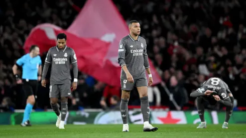 Kylian Mbappe of Real Madrid looks dejected after Mikel Merino of Arsenal (not pictured) scores his team's third goal during the UEFA Champions League 2024/25 Quarter Final First Leg match.