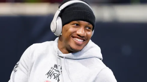Michael Penix Jr. #9 of the Atlanta Falcons smiles during warmups before playing the New York Giants at Mercedes-Benz Stadium on December 22, 2024 in Atlanta, Georgia.