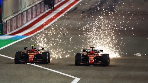 Sparks fly from the cars of Carlos Sainz driving the Ferrari SF-24 and Charles Leclerc driving the Ferrari SF-24 as they compete for track position during the F1 Grand Prix of Bahrain in 2024.