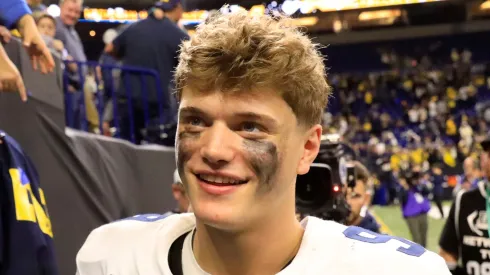 J.J. McCarthy interacts with fans after winning the Big Ten Championship against the Iowa Hawkeyes at Lucas Oil Stadium on December 02, 2023 in Indianapolis, Indiana.
