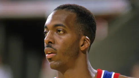 John Salley #22 of the Detroit Pistons looks on in a game during the 1989-1990 NBA season.
