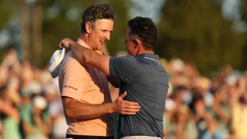 (R-L) Rory McIlroy of Northern Ireland shakes hands with Justin Rose of England after the playoff hole during the final round of the 2025 Masters Tournament at Augusta National Golf Club on April 13, 2025 in Augusta, Georgia.