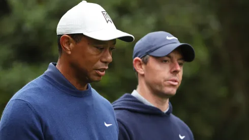 Tiger Woods of the United States and Rory McIlroy of Northern Ireland walk to the 11th fairway during a practice round prior to the 2023 Masters Tournament at Augusta National Golf Club on April 03, 2023 in Augusta, Georgia.