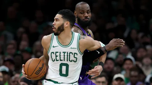 Los Angeles Lakers' LeBron James defends Boston Celtics' Jayson Tatum.
