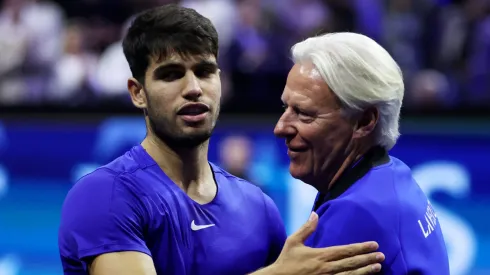 arlos Alcaraz of Team Europe celebrates after winning match point against Ben Shelton of Team World with Bjorn Borg.