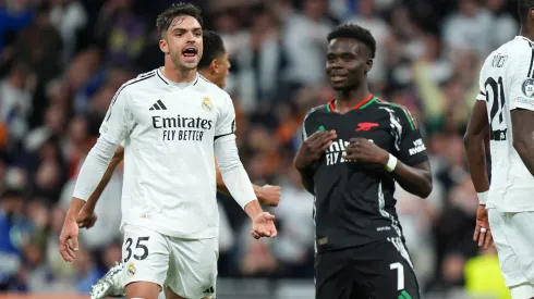 Raul Asencio of Real Madrid celebrates after teammate Thibaut Courtois (not pictured) saves the penalty kick from Bukayo Saka of Arsenal.
